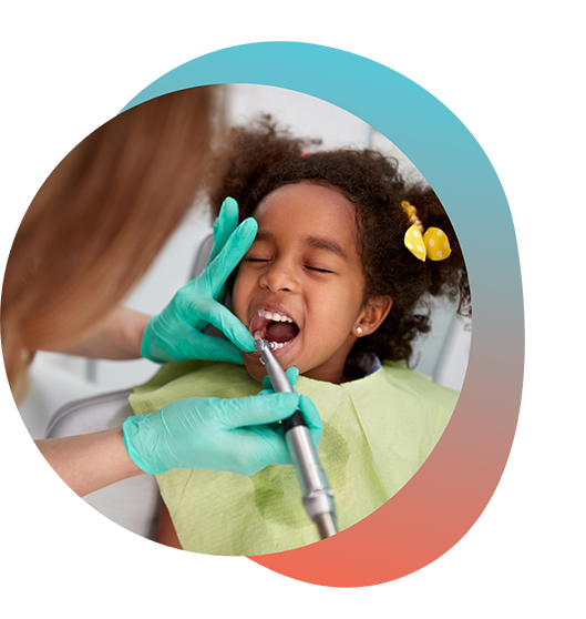 Little girl having her teeth examined