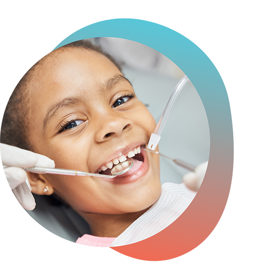 Young child smiling during dental examination