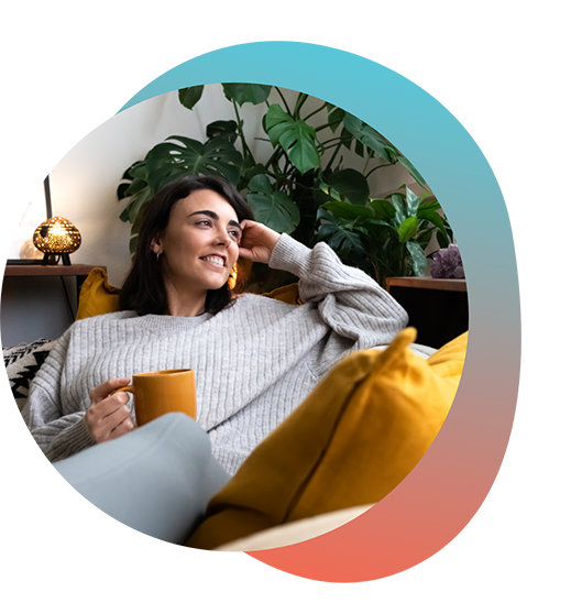 Woman relaxing on couch with mug