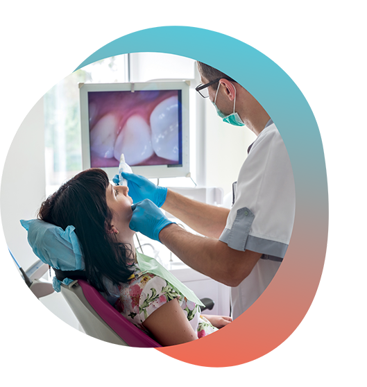 Dentist checking patients teeth with intraoral camera