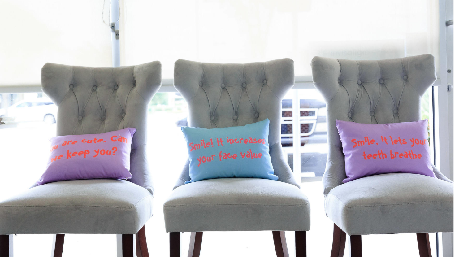 Chairs with pillows with messages on them