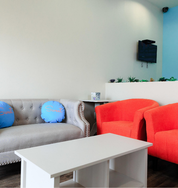 Dental waiting room with red chairs