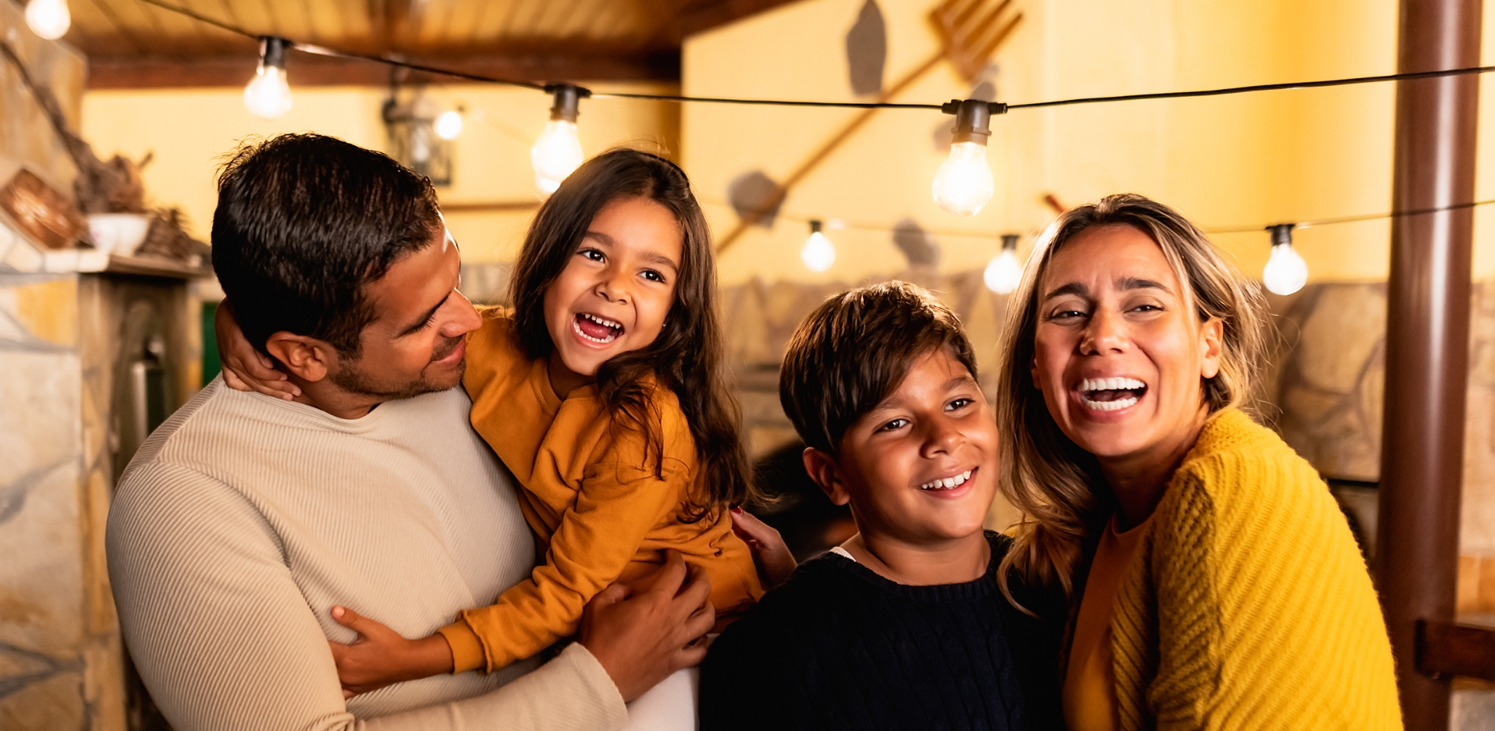 Parents playing with children in living room