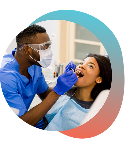 Female patient having teeth examined by male dentist