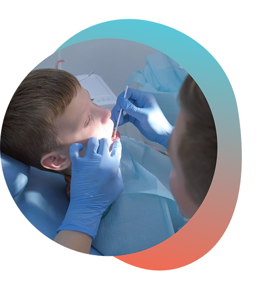 Dentist giving child a fluoride treatment