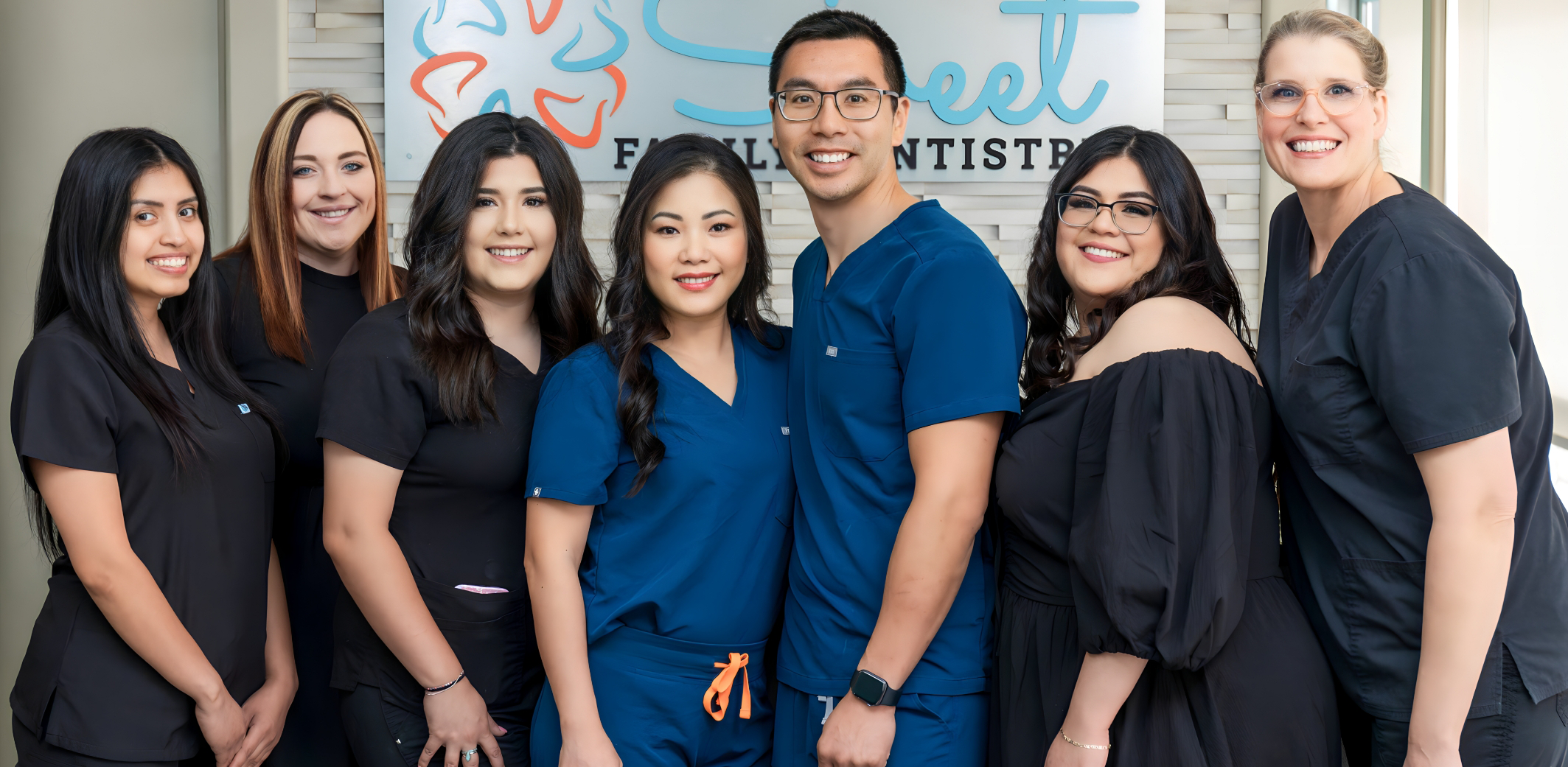 Dentists with dental team in Rowlett